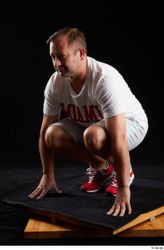 Whole Body Man White Sports Shirt Shorts Chubby Kneeling Studio photo references